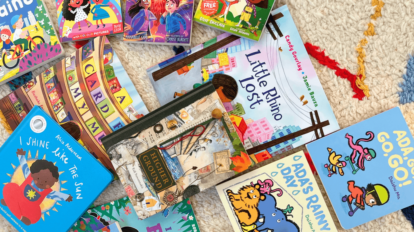 A photograph of some of the best diverse children's books out in March 2025 strewn over a colourful rug. 