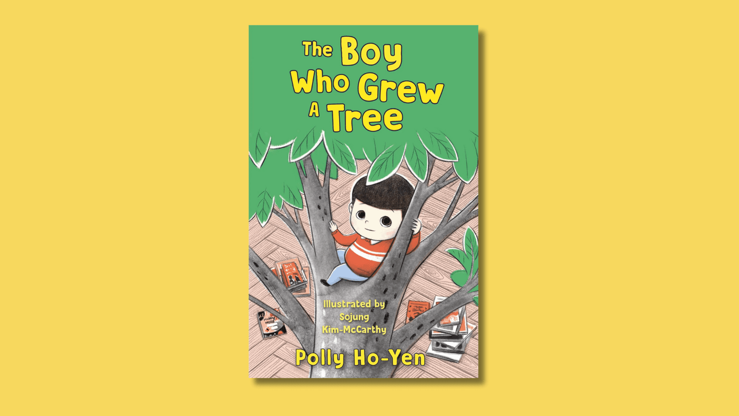 The cover of \nThe Boy Who Grew a Tree \nshows a young boy of East Asian heritage climbing a tree, looking tentative but hopeful. There are books on the parquet flooring beneath the tree.