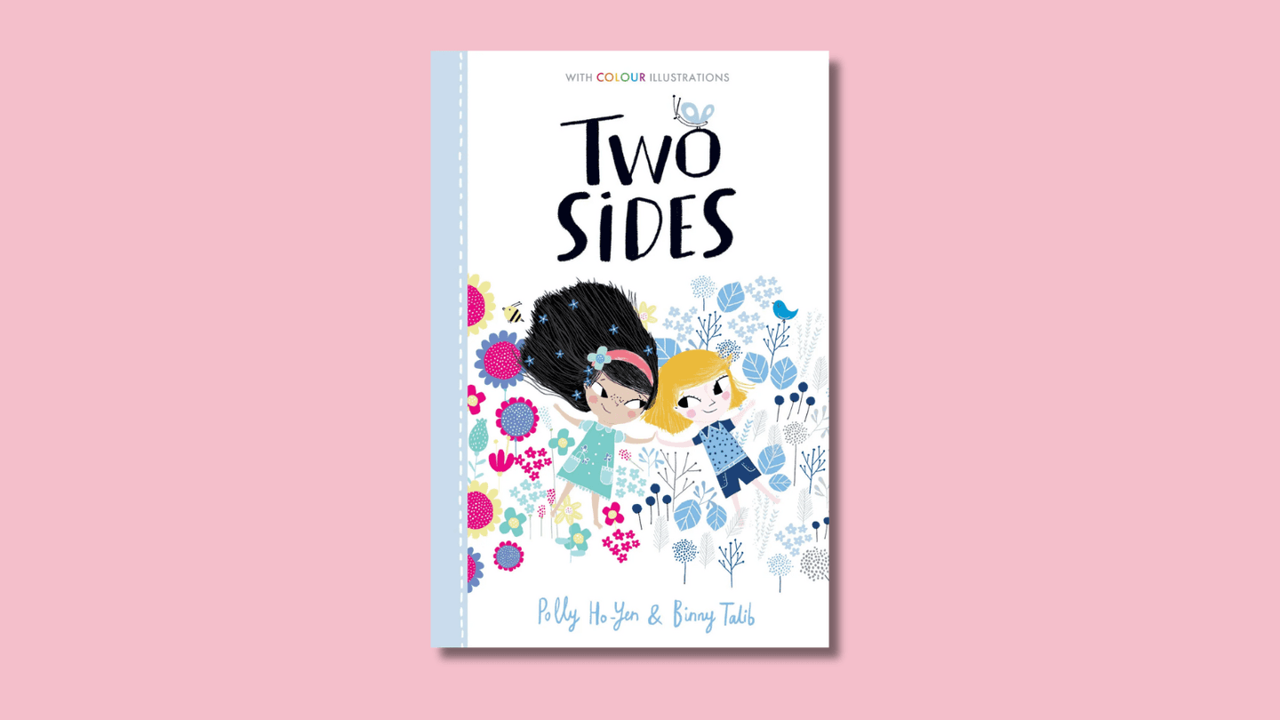 The cover of Two Sides shows two girls, lying down among flowers, holding hands. One has light brown skin and lots of long dark hair, and wears a dress; the other is white with a short blonde bob, and wears shorts and a t-shirt.