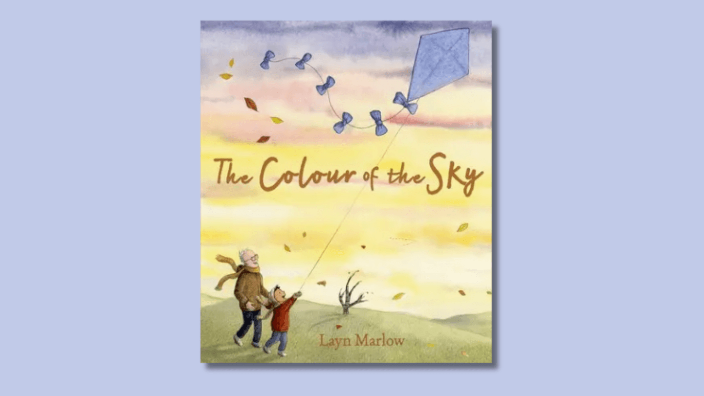 The cover of The Colour of the Sky shows a child and a grandfather flying a kite o a hill on a lbustery autumn day, with a shout of joy and a big smile respectively.