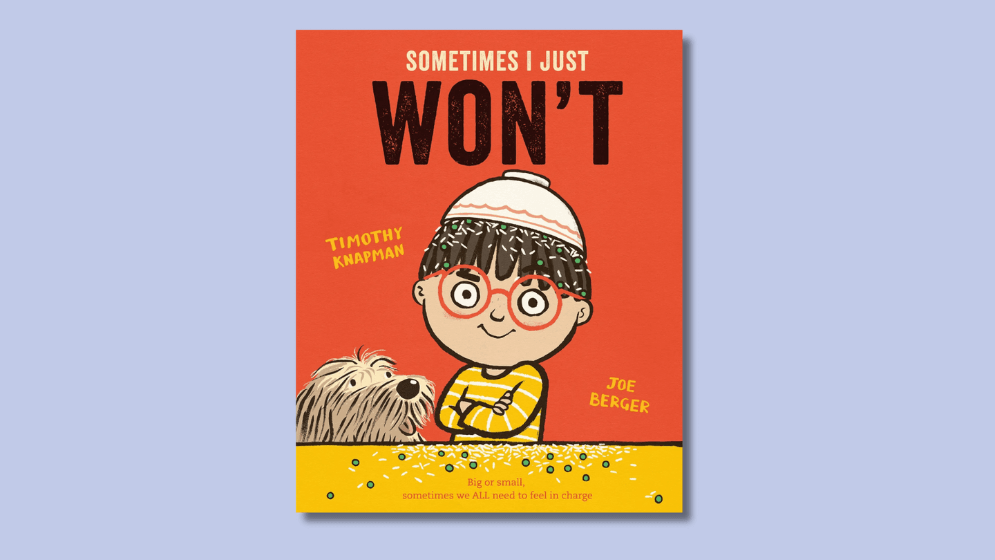 The cover of Sometimes I Just WON'T shows a little boy with a defiant expression and arms crossed over his chest. He wears red glasses and an upended bowl of food on his head.   