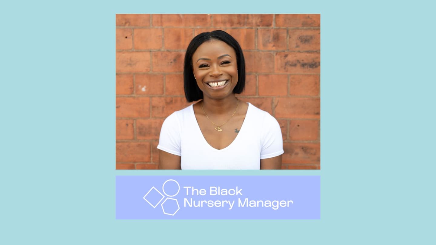 Young Black woman with a black bobbed hairstyle and a white T-shirt, standing against a brick wall. 
